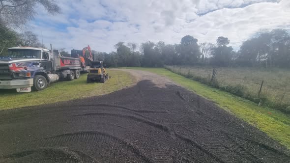 MJF truck and machinery at a rural driveway project